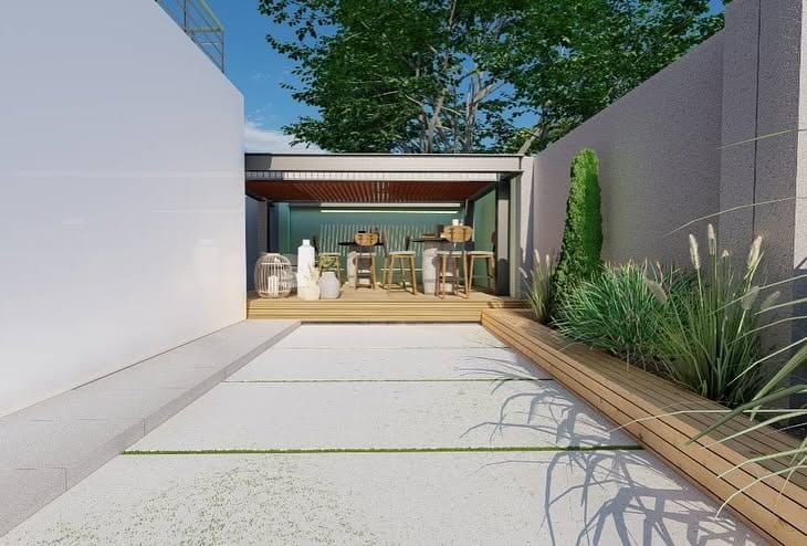 A narrow Harare side courtyard rebuilt by QDCreative into a covered bar, hardwood deck and ornamental grass garden